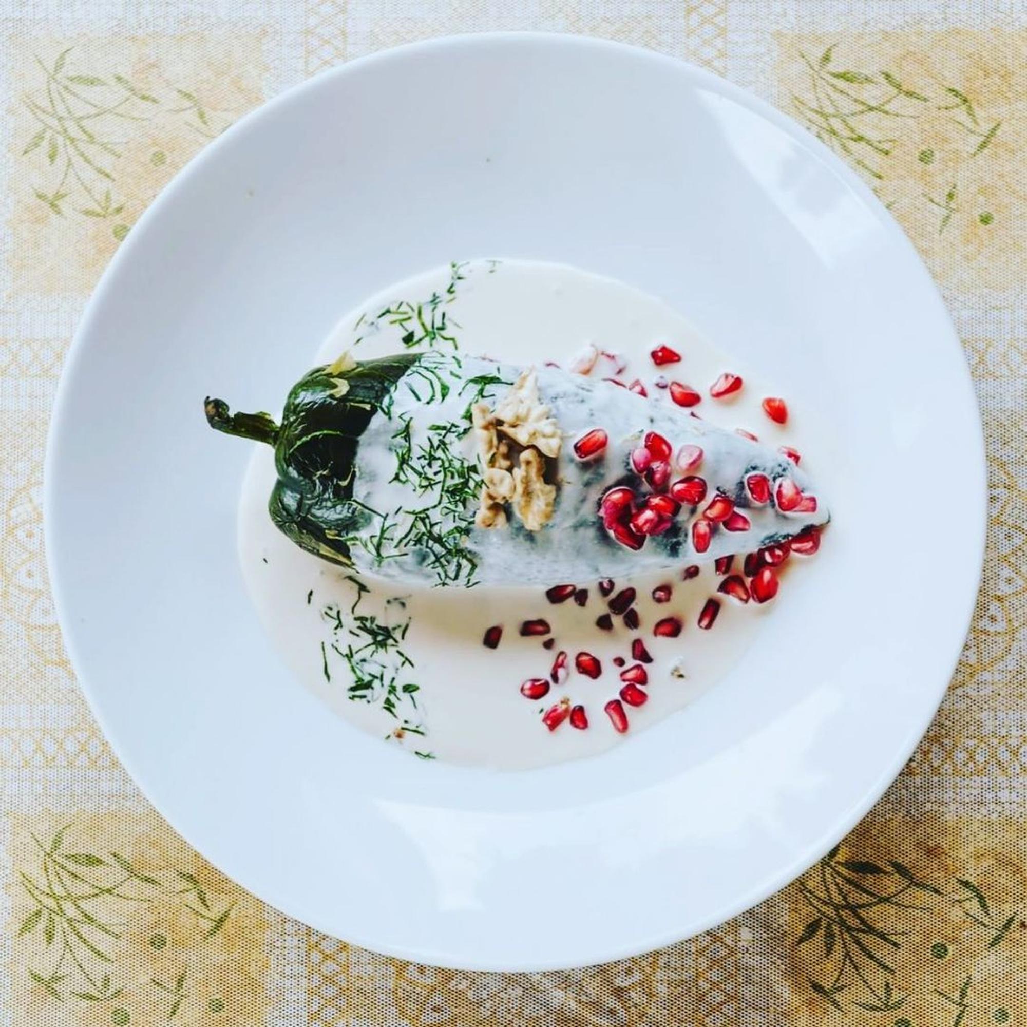 Plated seasonal tasting menu on ceramic plate